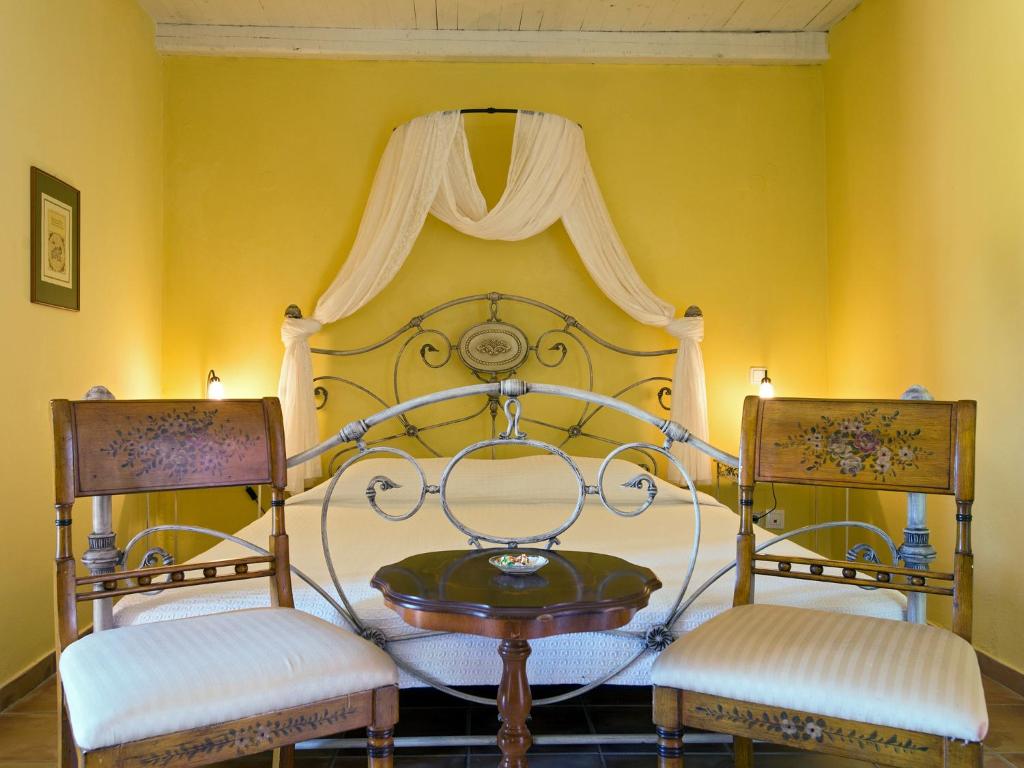 Postel nebo postele na pokoji v ubytování Villa De Loulia