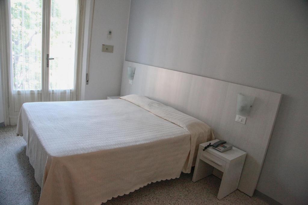 Postel nebo postele na pokoji v ubytování Hotel Annita Cervia