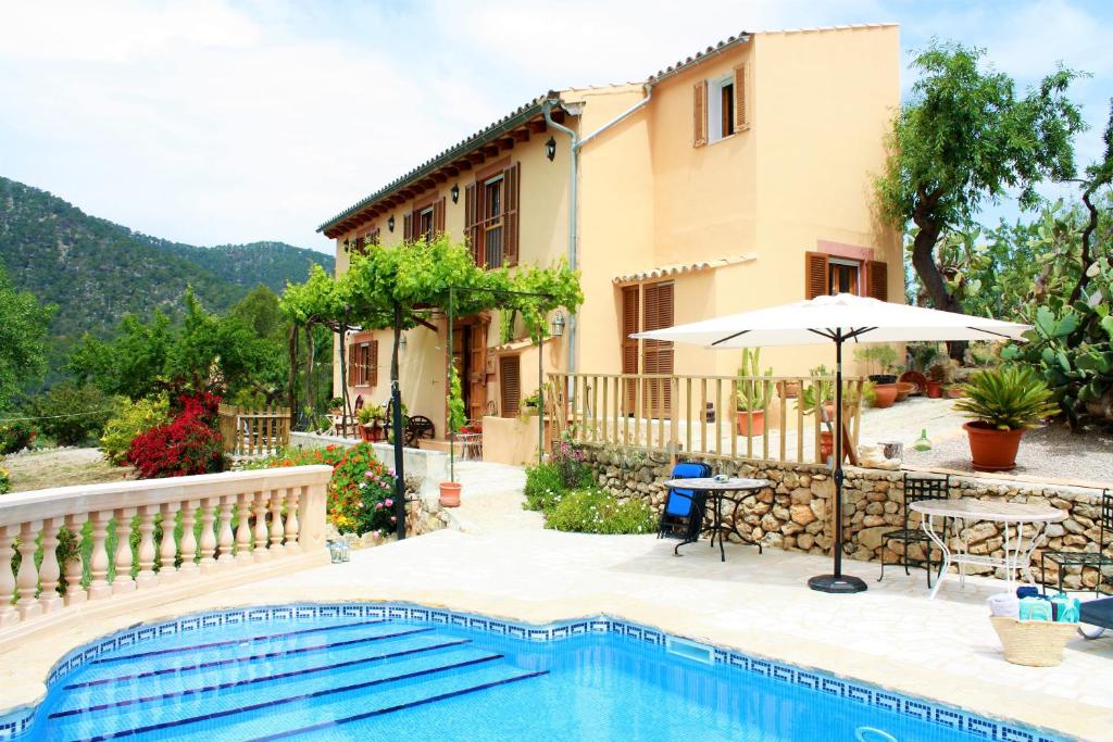 a villa with a swimming pool and a house at Villa Sa Teulera Alaro in Alaró