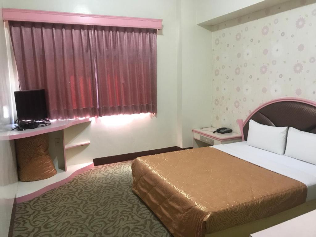 Postel nebo postele na pokoji v ubytování Teresa Hotel