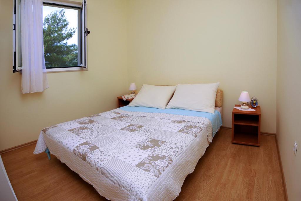 Posteľ alebo postele v izbe v ubytovaní Apartment Mirni Kutak