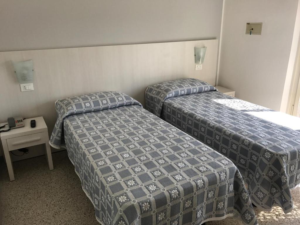 Postel nebo postele na pokoji v ubytování Hotel Annita Cervia