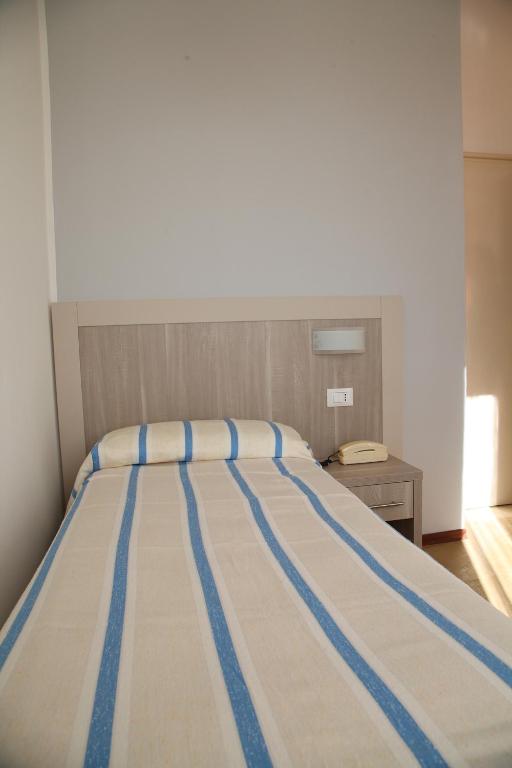 Postel nebo postele na pokoji v ubytování Hotel Annita Cervia