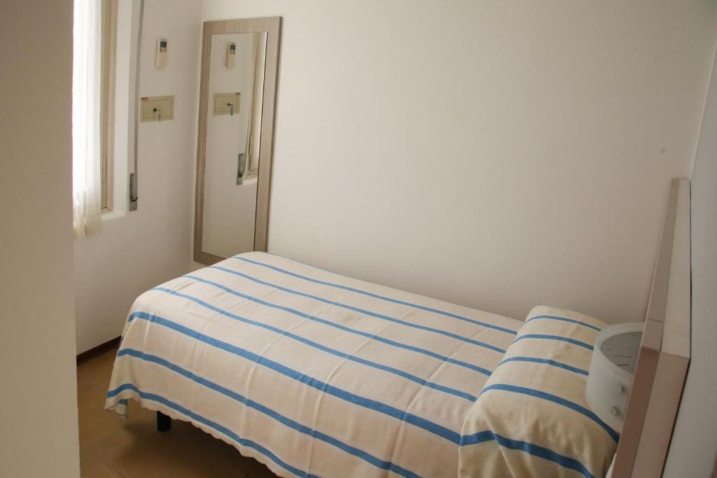 Postel nebo postele na pokoji v ubytování Hotel Annita Cervia