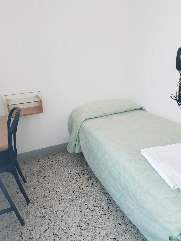 Postel nebo postele na pokoji v ubytování Hotel Amados
