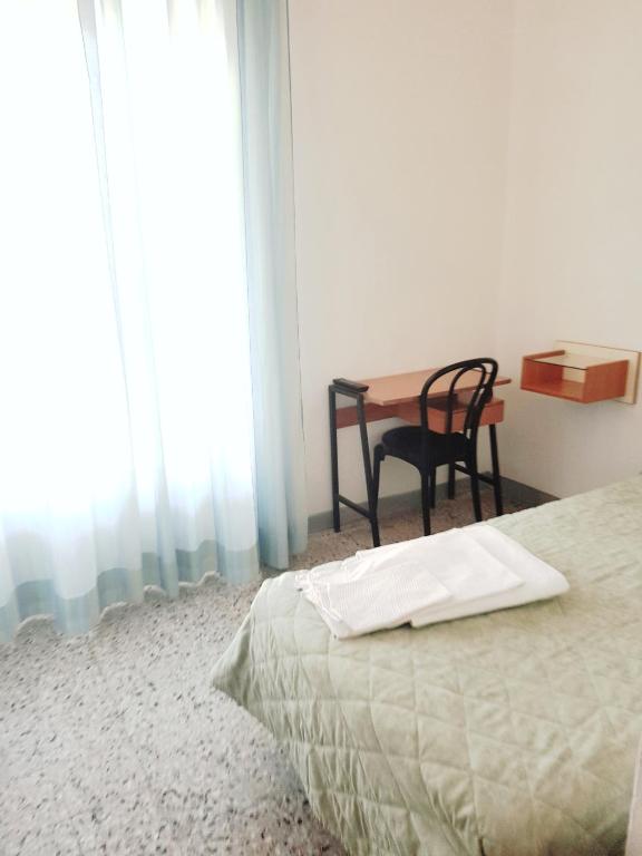 Postel nebo postele na pokoji v ubytování Hotel Amados