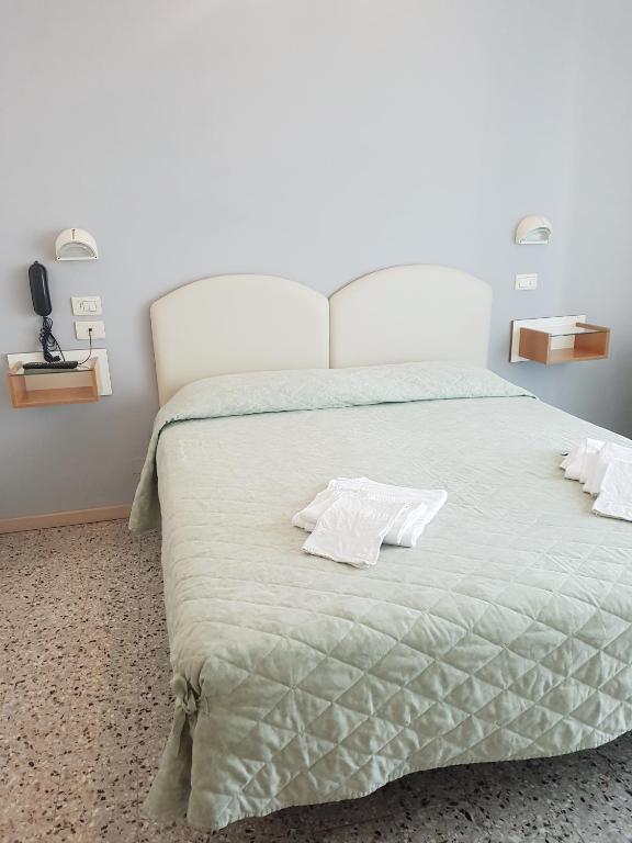 Postel nebo postele na pokoji v ubytování Hotel Amados