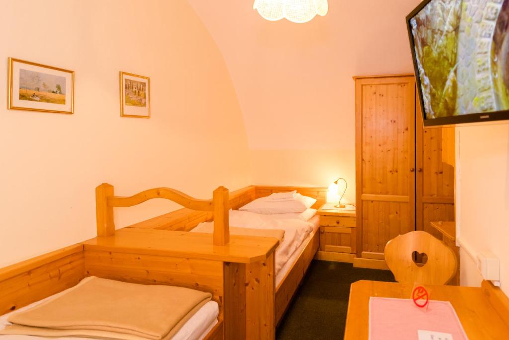 Postel nebo postele na pokoji v ubytování Gasthof Grillitsch Rösslwirt