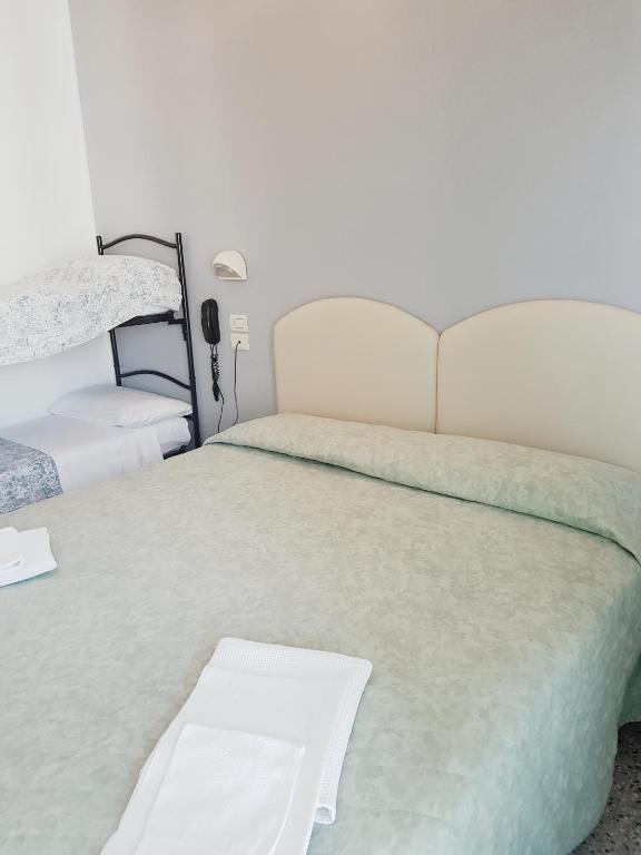 Postel nebo postele na pokoji v ubytování Hotel Amados