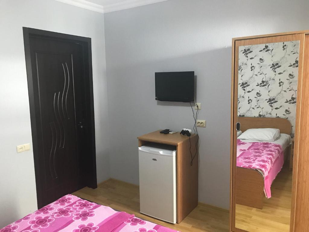 Llit o llits en una habitació de Kvariati - Guest House