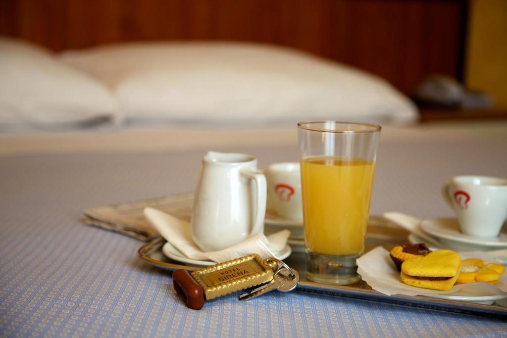 Postel nebo postele na pokoji v ubytování Hotel Sirena