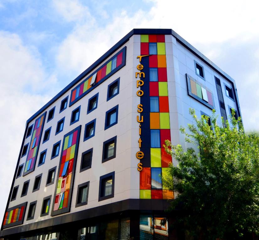 a building with a rainbow painted on it at Tempo Suites Airport in Istanbul