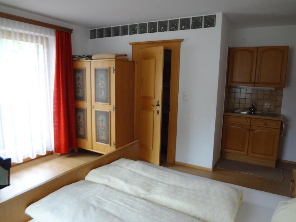 Postel nebo postele na pokoji v ubytování Haus Bergheimat
