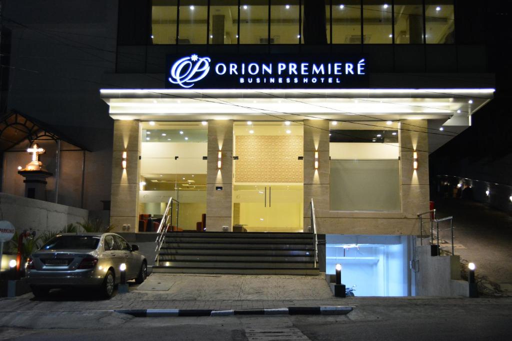a car parked in front of a building at night at Hotel Orion Premiere in Panaji
