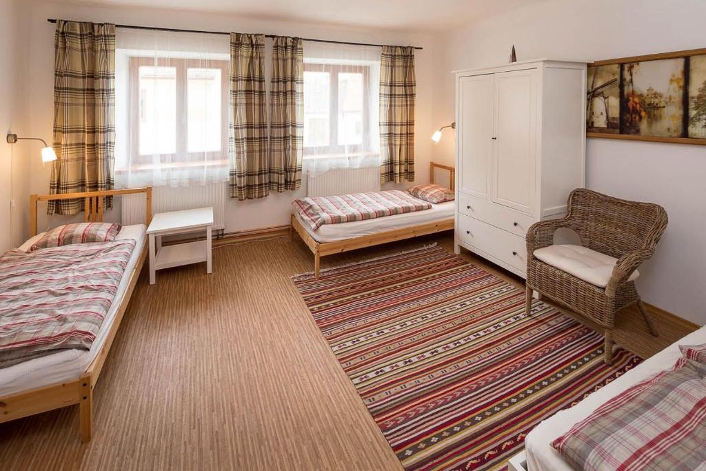 Postel nebo postele na pokoji v ubytování Apartmány Pod náměstím