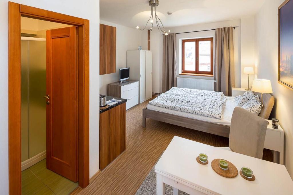 Postel nebo postele na pokoji v ubytování Apartmány Pod náměstím