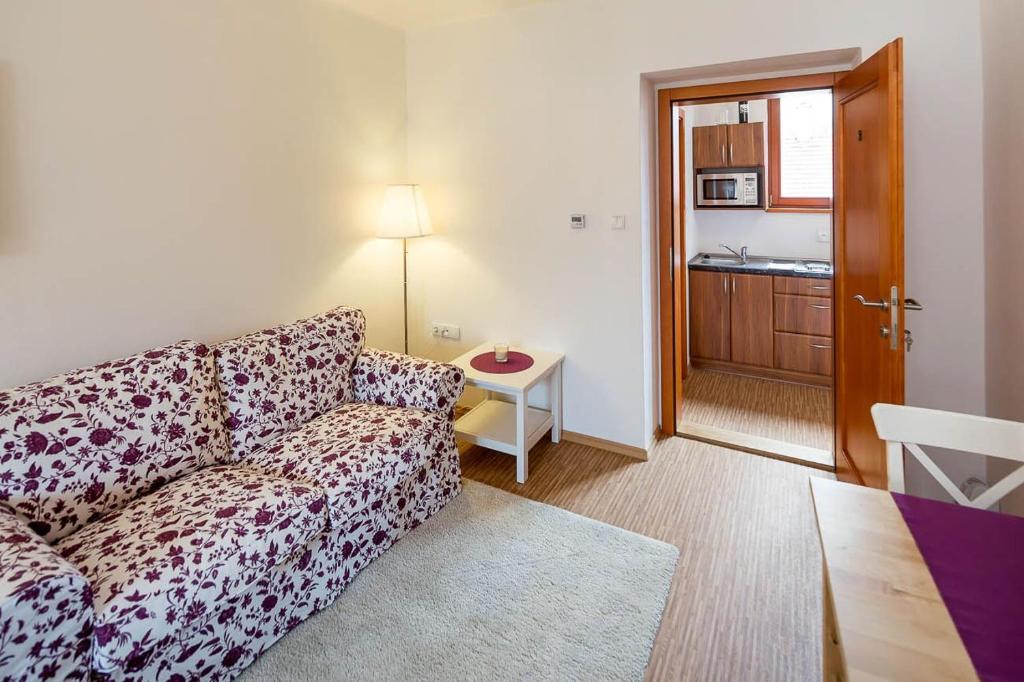Postel nebo postele na pokoji v ubytování Apartmány Pod náměstím