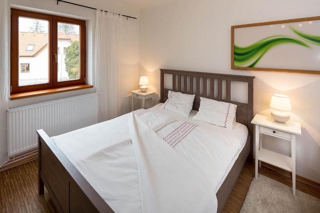Postel nebo postele na pokoji v ubytování Apartmány Pod náměstím