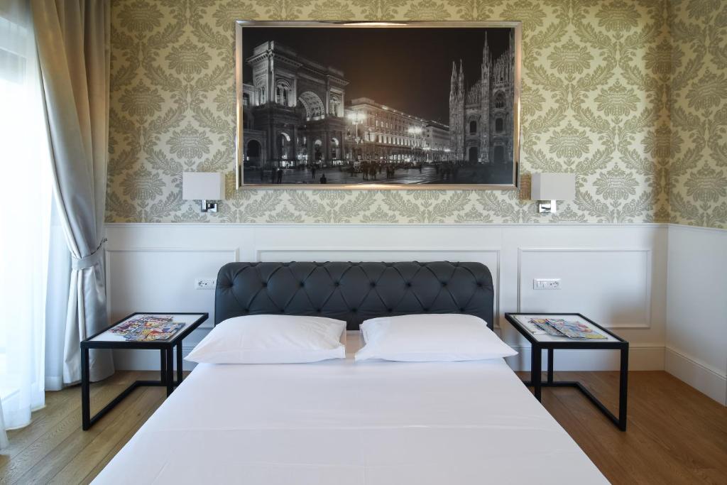 Postel nebo postele na pokoji v ubytování Suite Milano Duomo