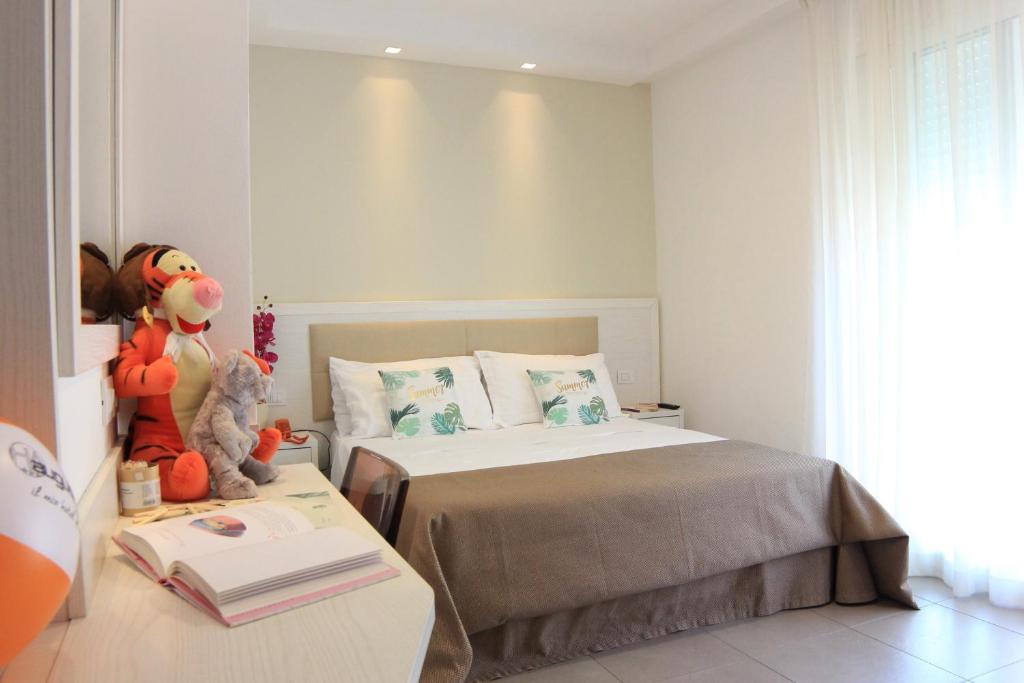 Postel nebo postele na pokoji v ubytování Hotel Augustus- Davanti a noi c'è solo il mare
