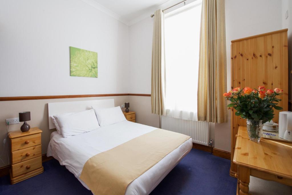 Letto o letti in una camera di Hotel Meridiana