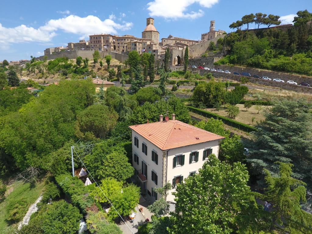 an aerial view of a building on a hill at Hotel Villa Porta All'Arco in Volterra