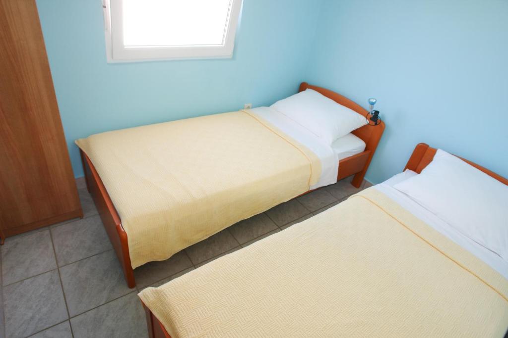 Postel nebo postele na pokoji v ubytování Apartments Andro