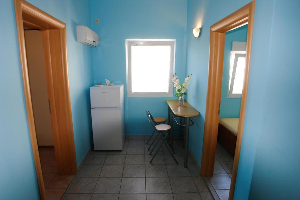 Kuchyň nebo kuchyňský kout v ubytování Apartments Andro