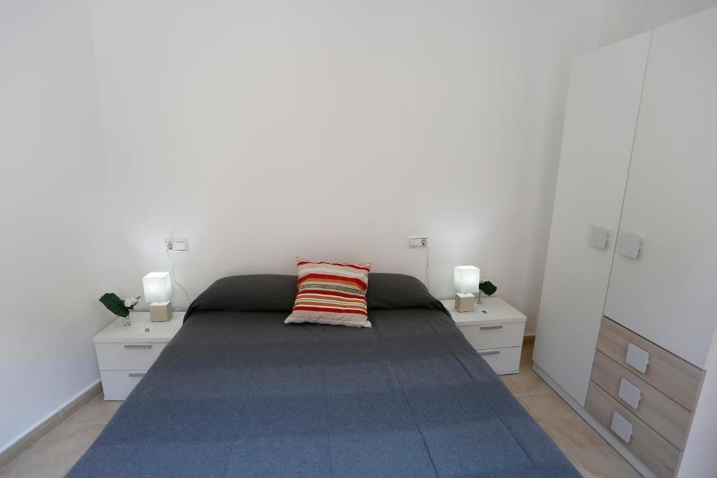 Posteľ alebo postele v izbe v ubytovaní Apartaments Claudia