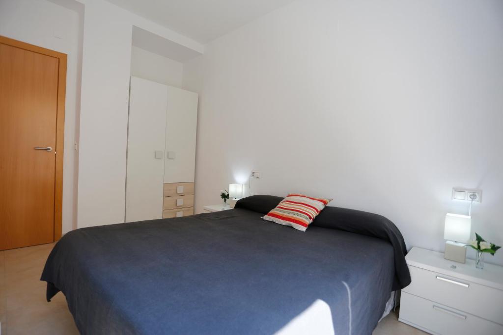 Posteľ alebo postele v izbe v ubytovaní Apartaments Claudia