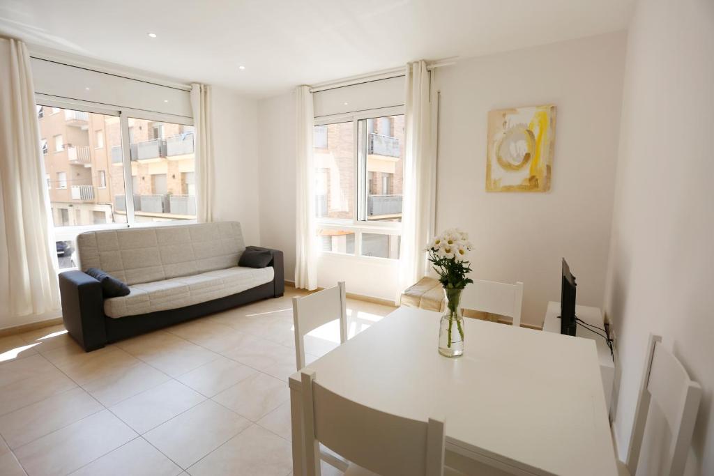 Posteľ alebo postele v izbe v ubytovaní Apartaments Claudia