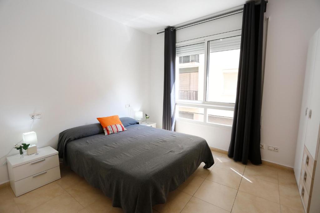 Posteľ alebo postele v izbe v ubytovaní Apartaments Claudia