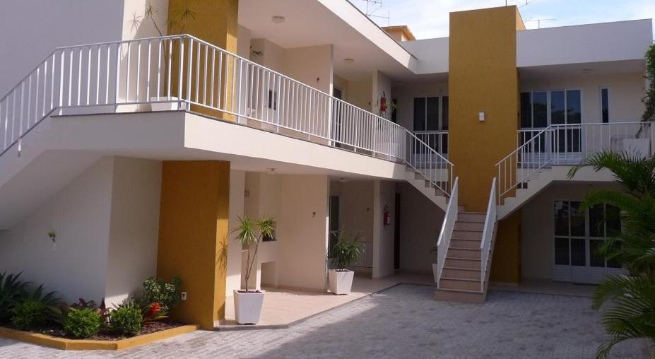 a building with a staircase on the side of it at Pousada Barra Nativa in Florianópolis