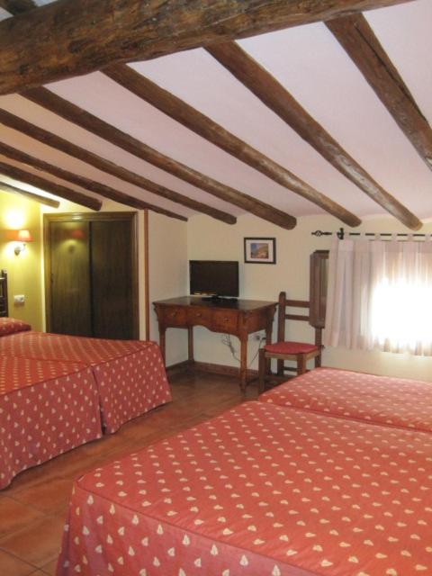 Postel nebo postele na pokoji v ubytování Hotel Olimpia