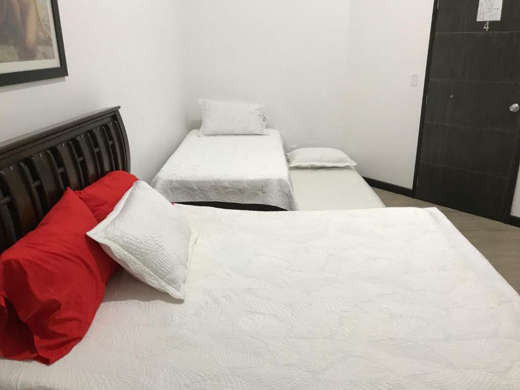 Postel nebo postele na pokoji v ubytování Hospedaje Solymar Sarie Bay