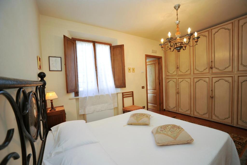 Postel nebo postele na pokoji v ubytování B&B Il Pettirosso di Siena