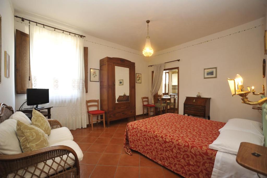 Postel nebo postele na pokoji v ubytování B&B Il Pettirosso di Siena