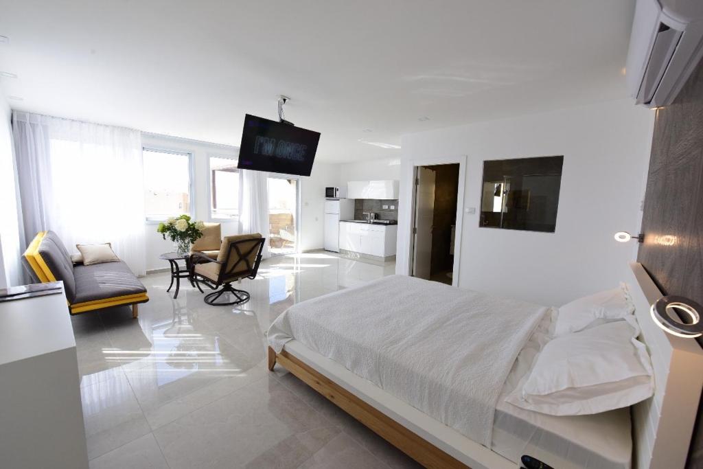 Postel nebo postele na pokoji v ubytování Presidential Penthouse