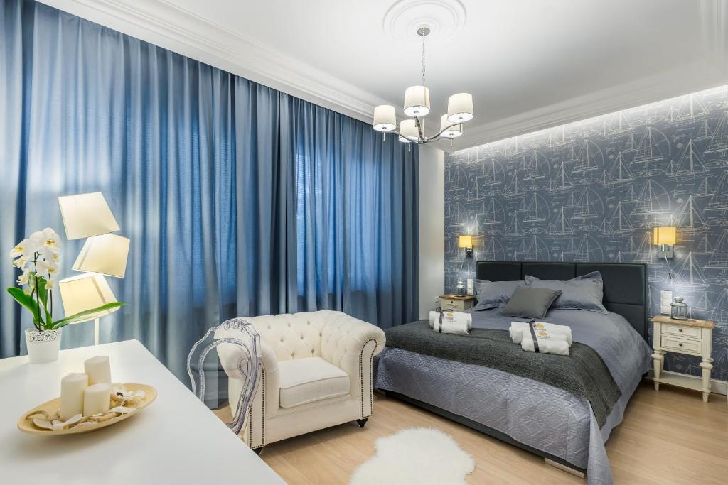 Łóżko lub łóżka w pokoju w obiekcie Sea Sail Apartments