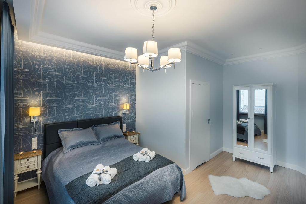 Łóżko lub łóżka w pokoju w obiekcie Sea Sail Apartments