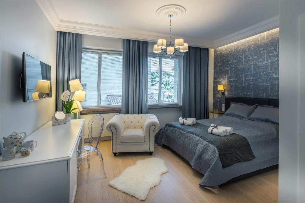 Łóżko lub łóżka w pokoju w obiekcie Sea Sail Apartments