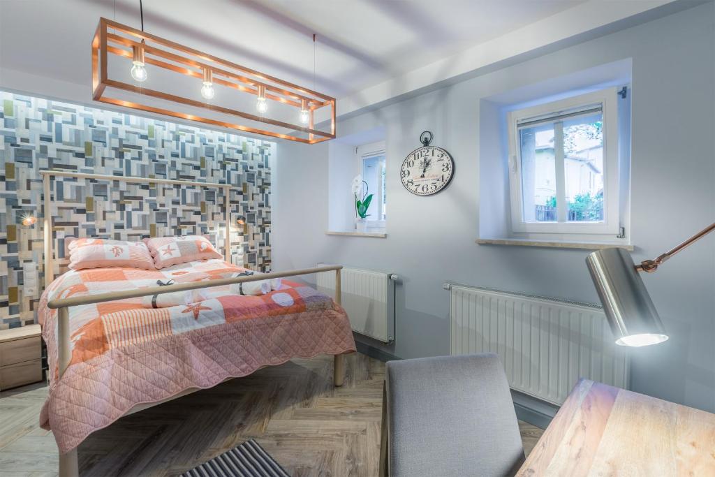 Łóżko lub łóżka w pokoju w obiekcie Sea Sail Apartments