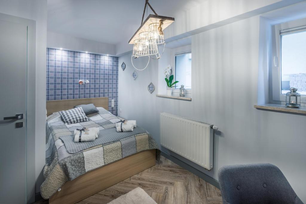 Łóżko lub łóżka w pokoju w obiekcie Sea Sail Apartments
