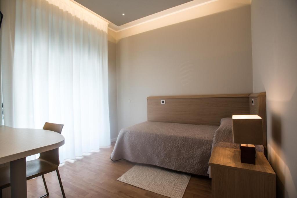 Postel nebo postele na pokoji v ubytování Hotel Eurovil Garni