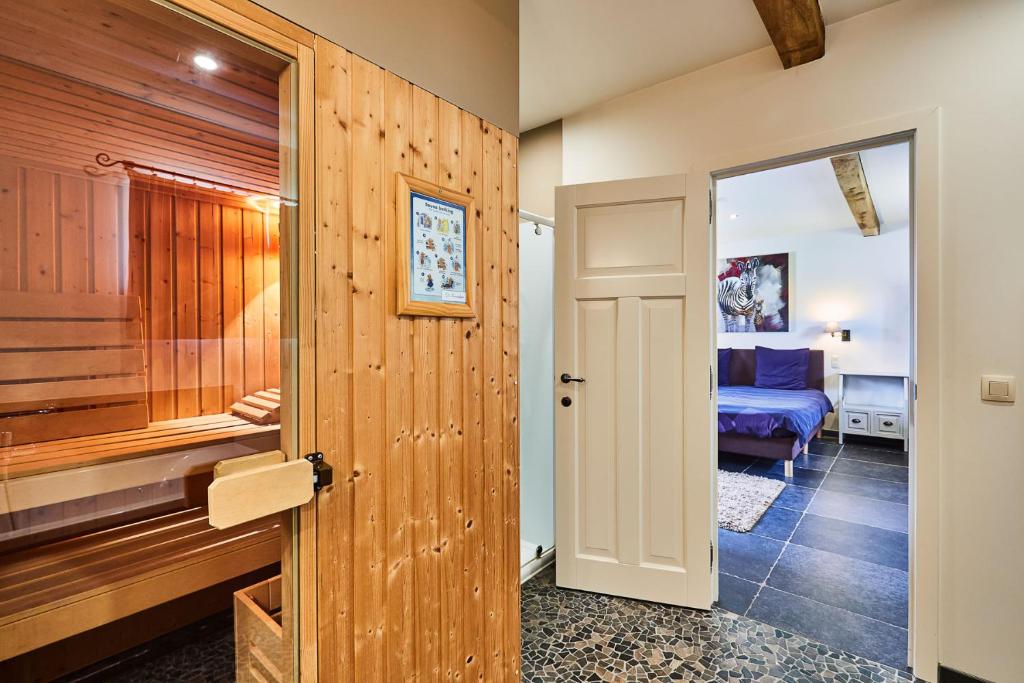 Postel nebo postele na pokoji v ubytování Wellness B&B De Zevenslaper