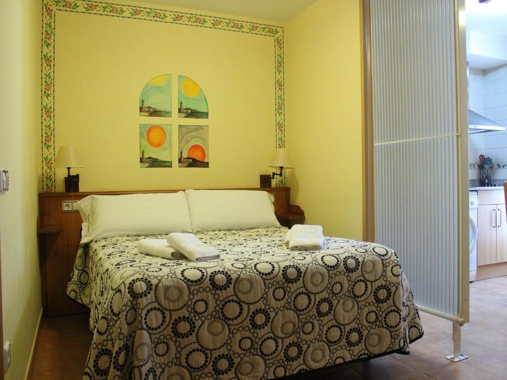 Postel nebo postele na pokoji v ubytování Hotel Casa Domenc