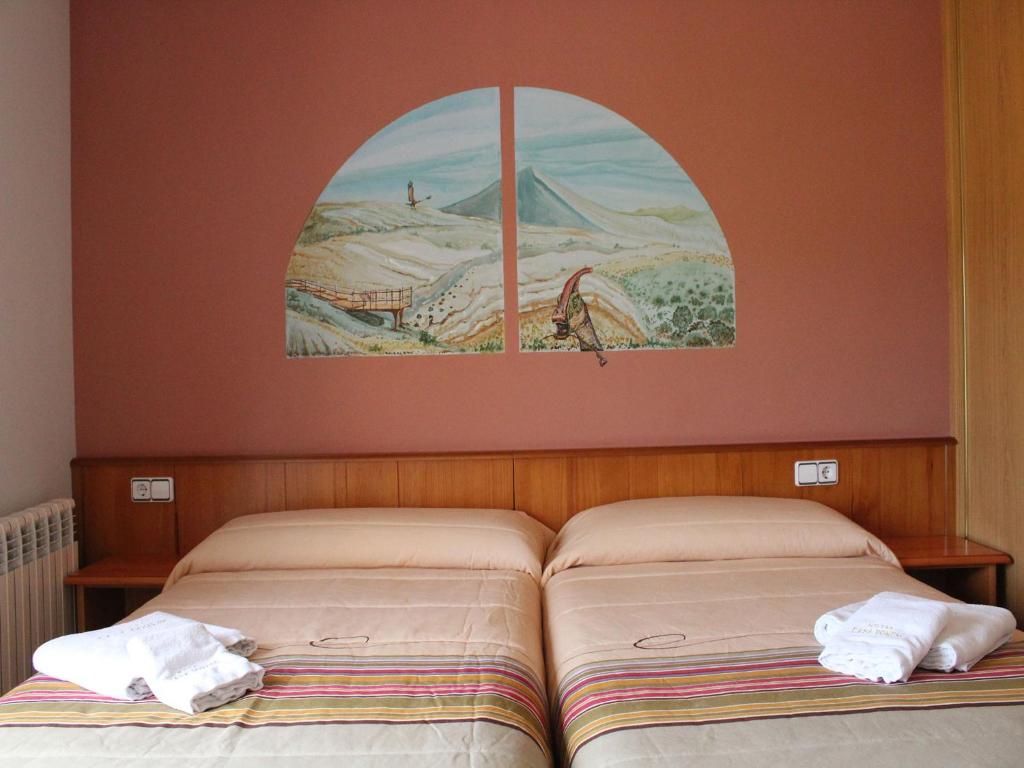 Postel nebo postele na pokoji v ubytování Hotel Casa Domenc