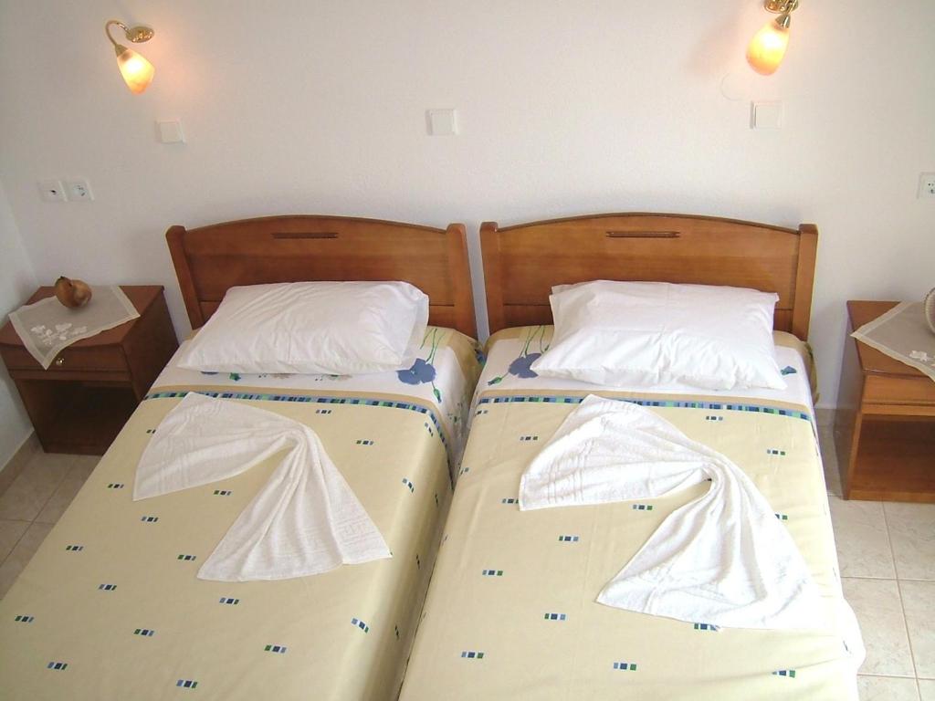 Postel nebo postele na pokoji v ubytování Estelle Hotel