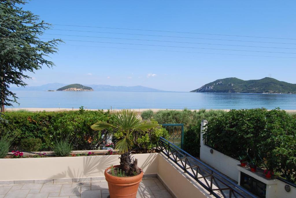 a view of the ocean from the balcony of a house at Blue Crystal Villa in Iraklitsa