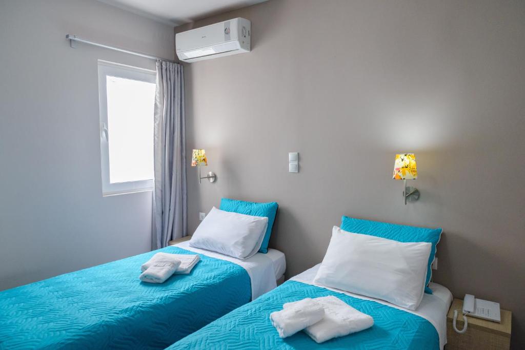 Ένα ή περισσότερα κρεβάτια σε δωμάτιο στο LUX Hotel